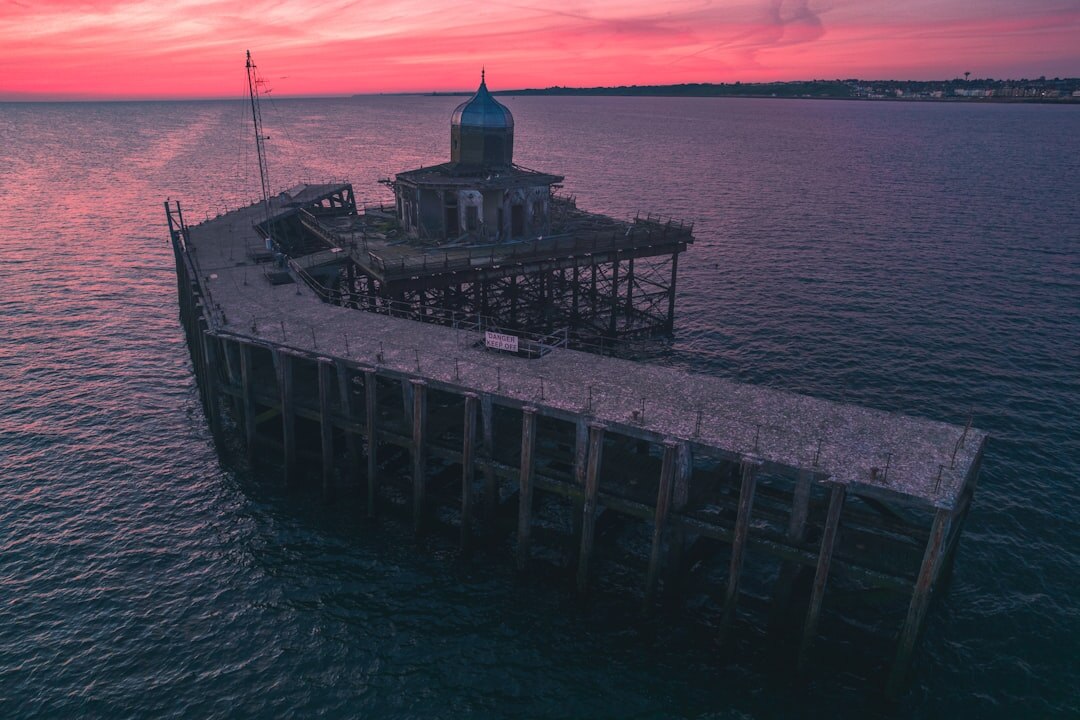 Victorian seaside pier stretching over the English Channel