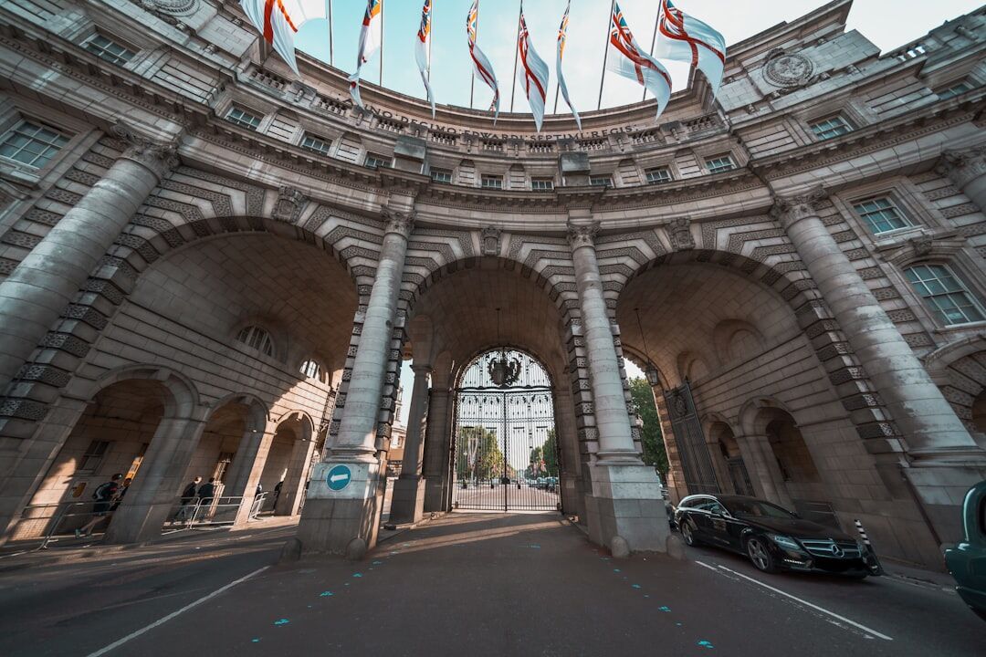 Grand royal palace facade in London with ornate gates